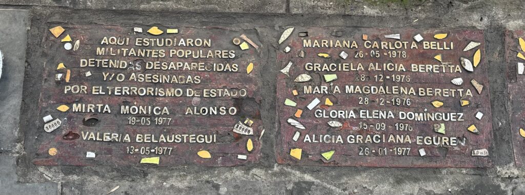 Plaque from the streets of Buenos Aires with the names and details of several disappeared people